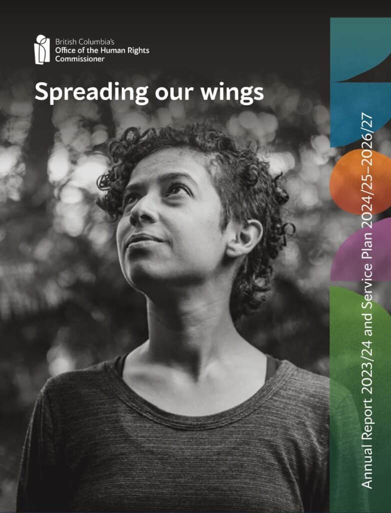 A woman with medium tone skin and short curly hair looks upwards in hope.